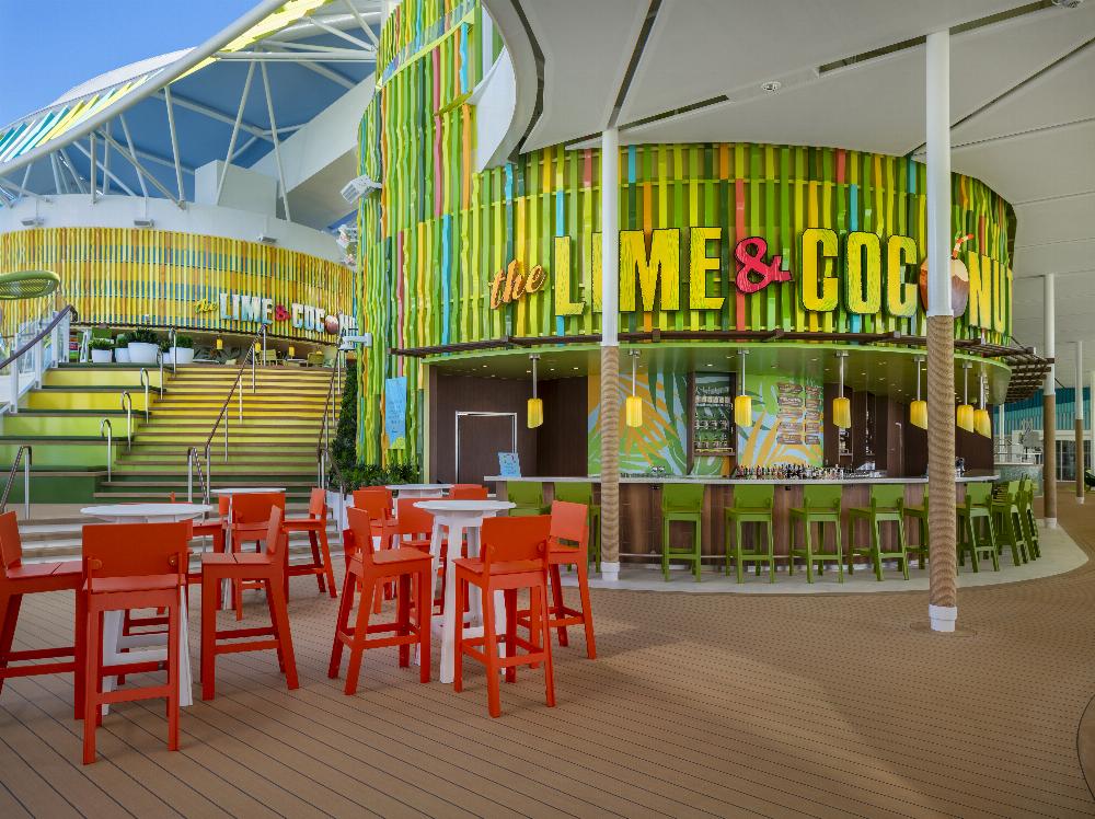 The Lime & Coconut bar with bright green facade and orange deck seating