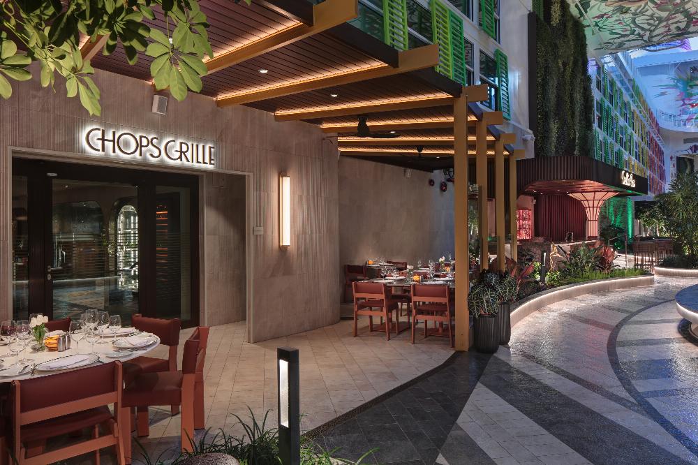 Chops Grille steakhouse entrance with alfresco terrace seating in Central Park