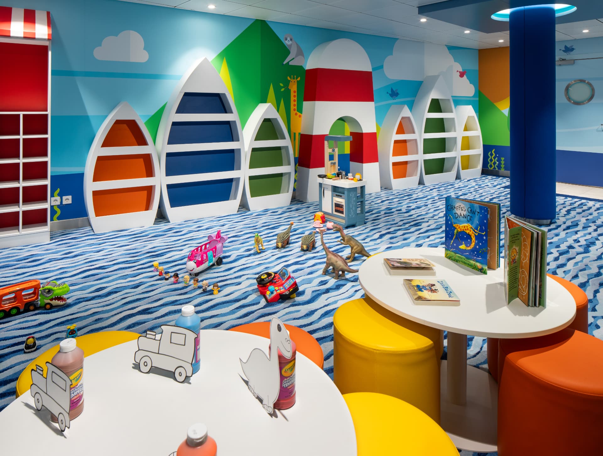 Adventure Ocean junior room with boat-shaped shelving, toys and craft tables